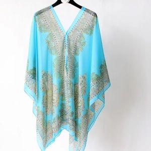 TIK TOK PONCHO/WRAP.   Can be worn several different ways. Black, Teal, & Pink.